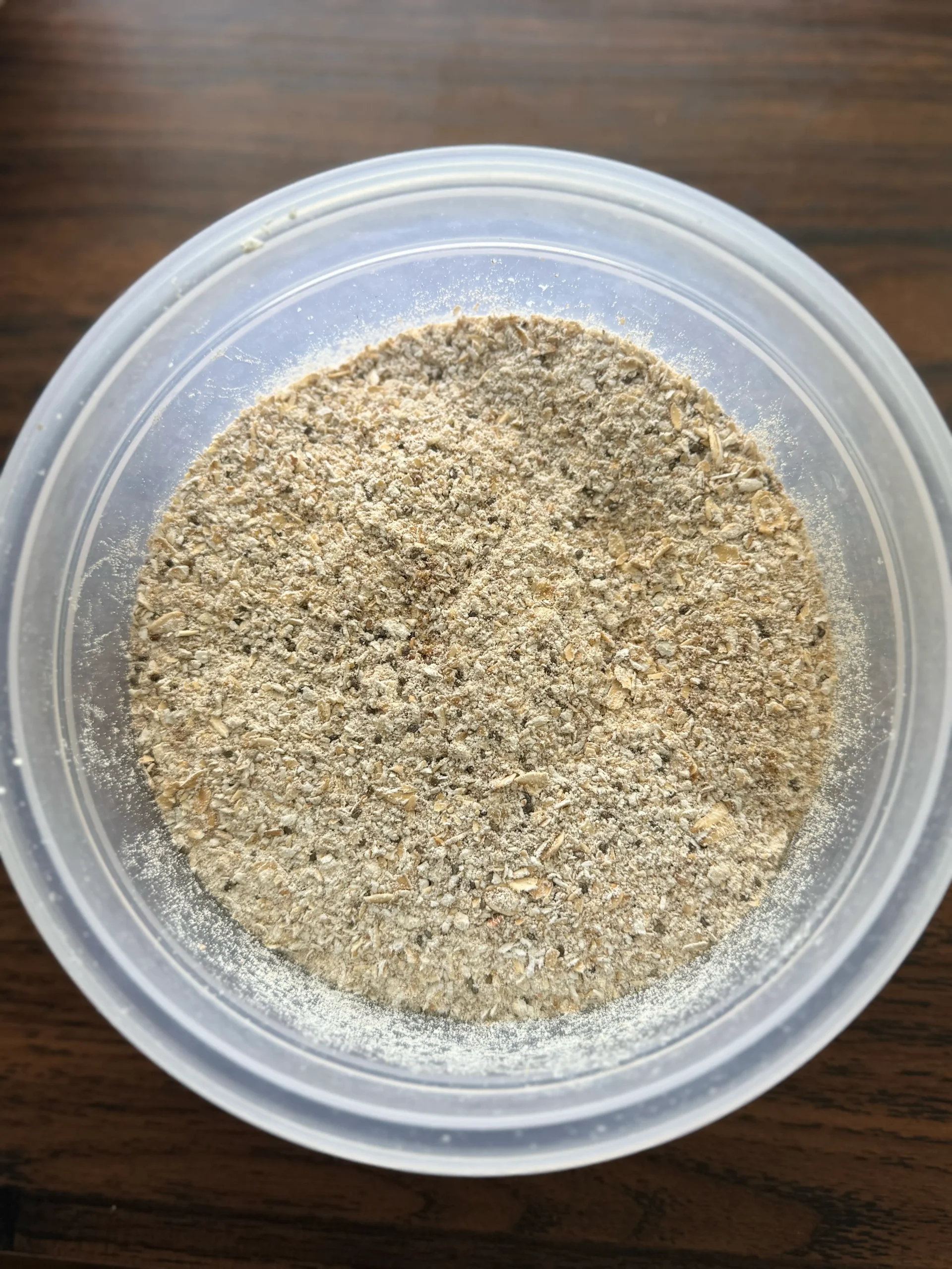 Blended oats, chia seeds and protein powder in a bowl.