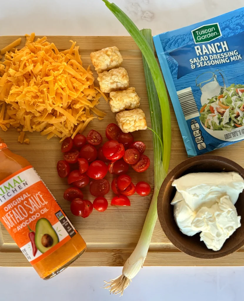 Buffalo sauce with cherry tomatoes and cheese. A packet of ranch and cream cheese for a healthy dinner.