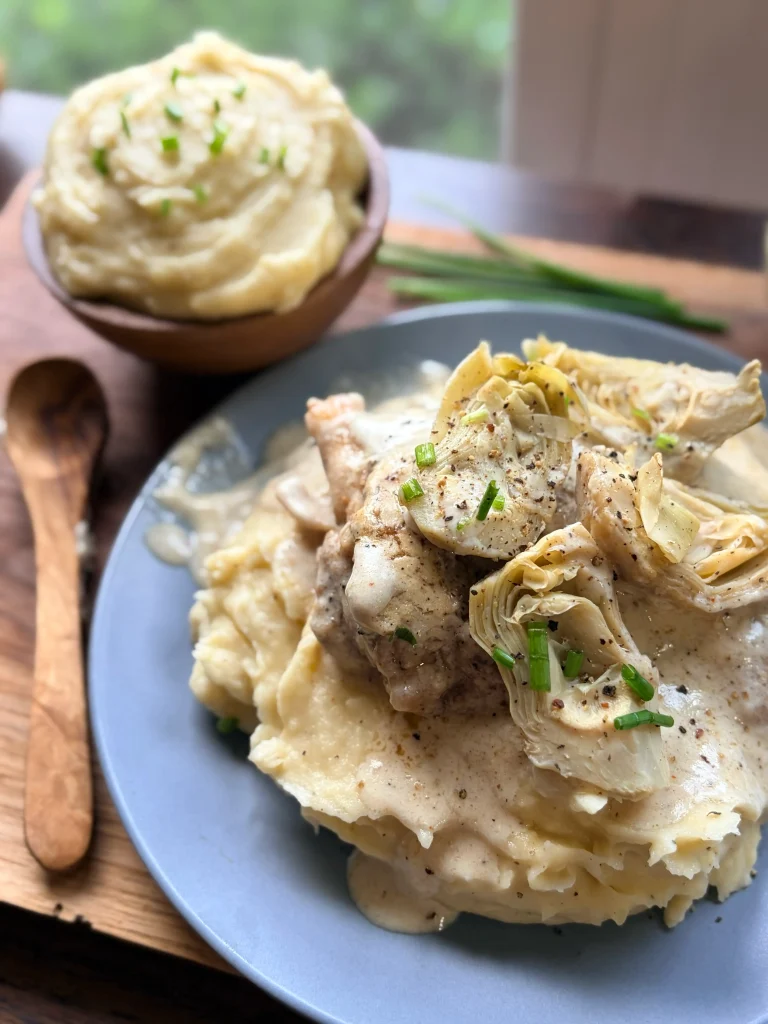 Creamy artichoke chicken with whipped mashed potatoes.