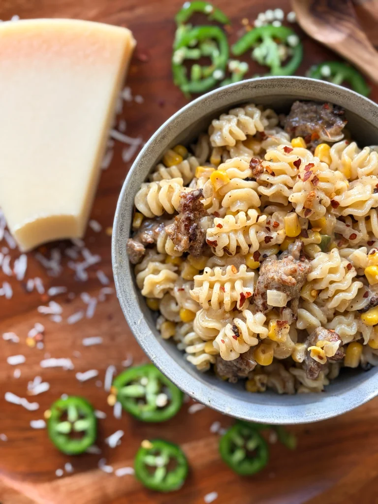 Creamy corn and sausage pasta with jalapeno and fresh parmesan cheese.