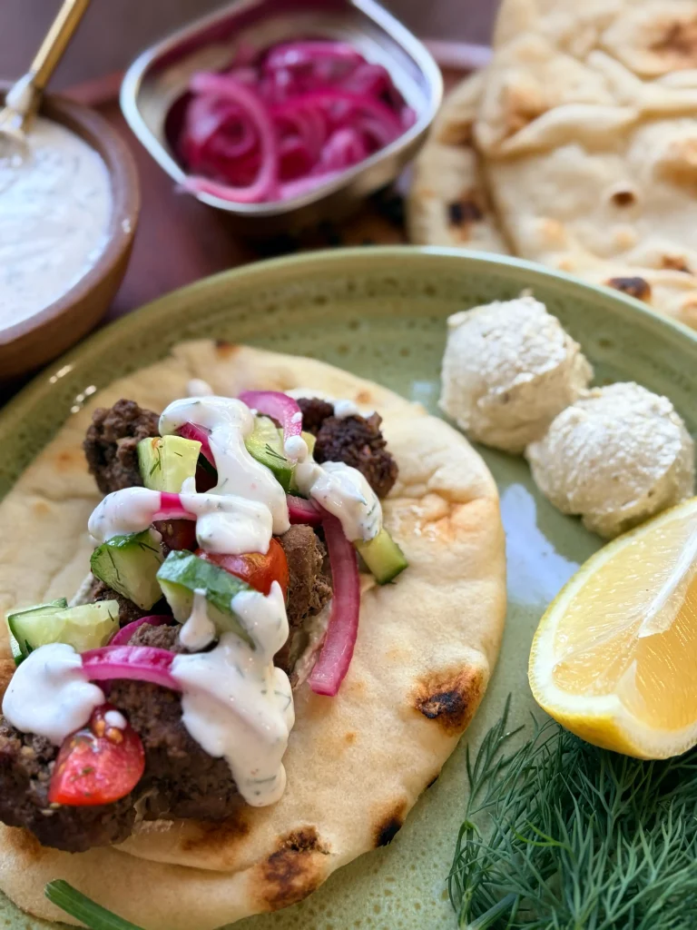 Greek lamb pitas with whipped feta and pickled onions for dinner for family.