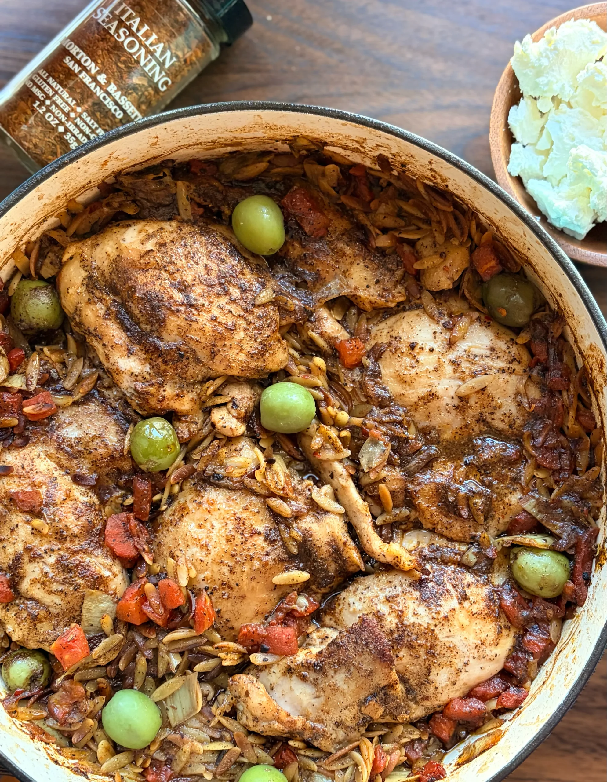 Braised chicken with orzo green olives and goat cheese.
