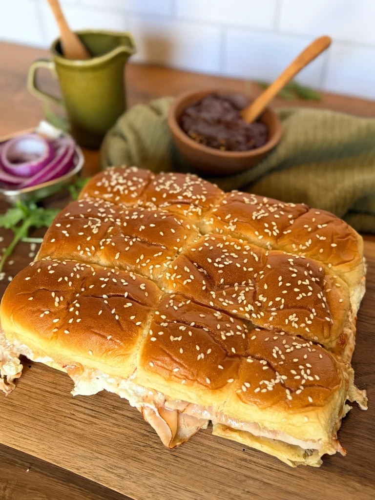 Goat cheese and pepper jelly hawaiian roll sliders appetizer.