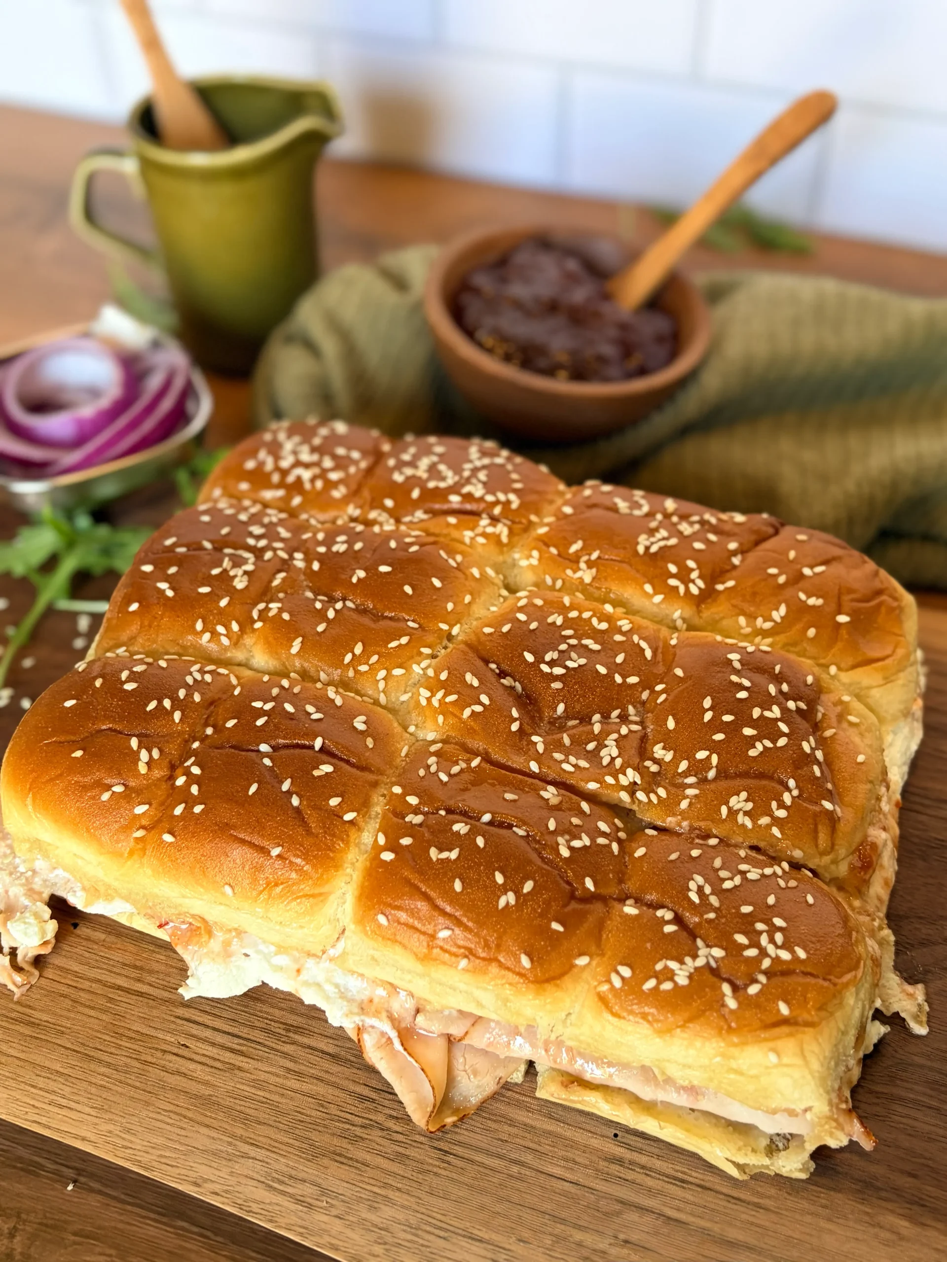 Goat cheese and pepper jelly hawaiian roll sliders appetizer.