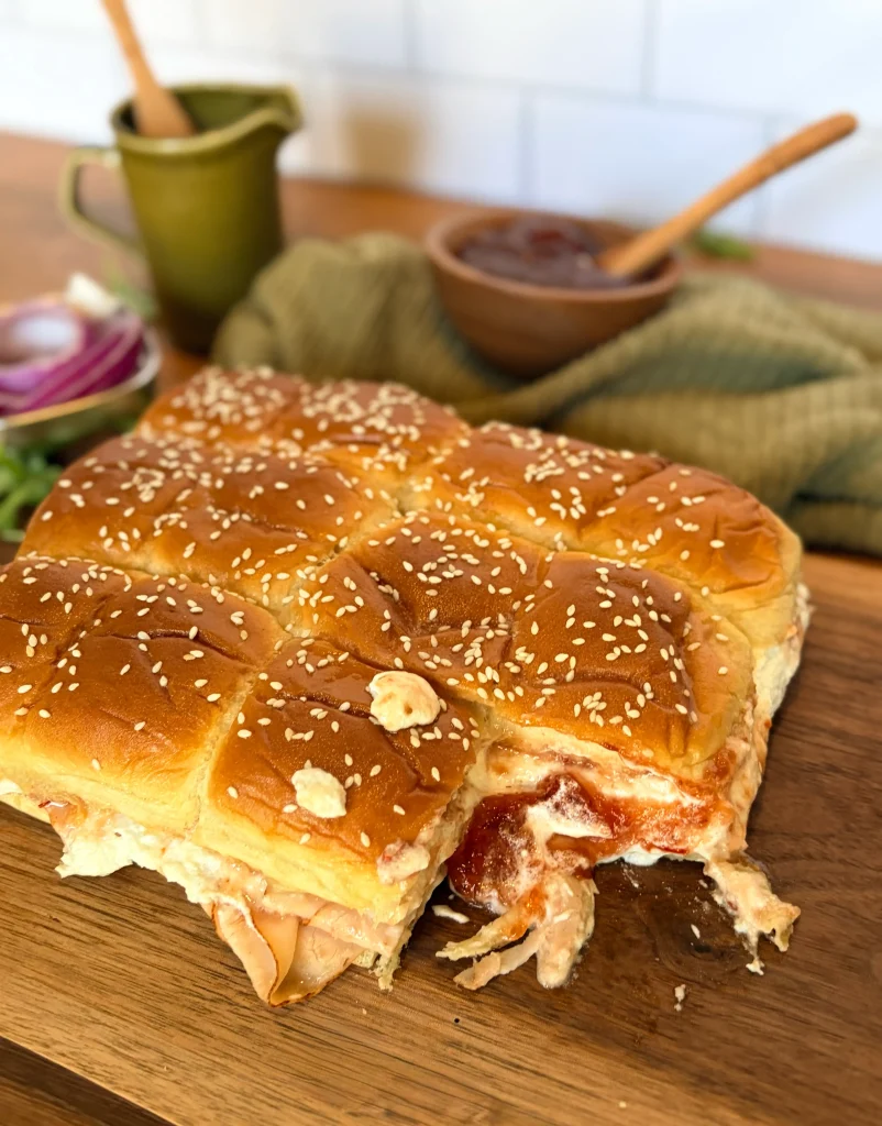 Goat cheese and pepper jelly hawaiian roll sliders appetizer.